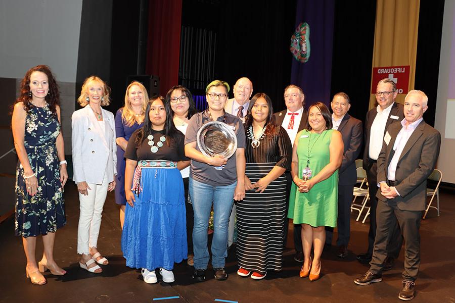 Members of the SJC Executive Cabinet stand with winner of the Fran Sandoval award at Fall 2023 Convocation.